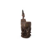 AN AFRICAN CARVED WOOD FIGURE WITH BOWL,