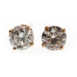 A PAIR OF DIAMOND STUD EARRINGS