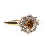 A COLOURED DIAMOND FLORAL CLUSTER RING