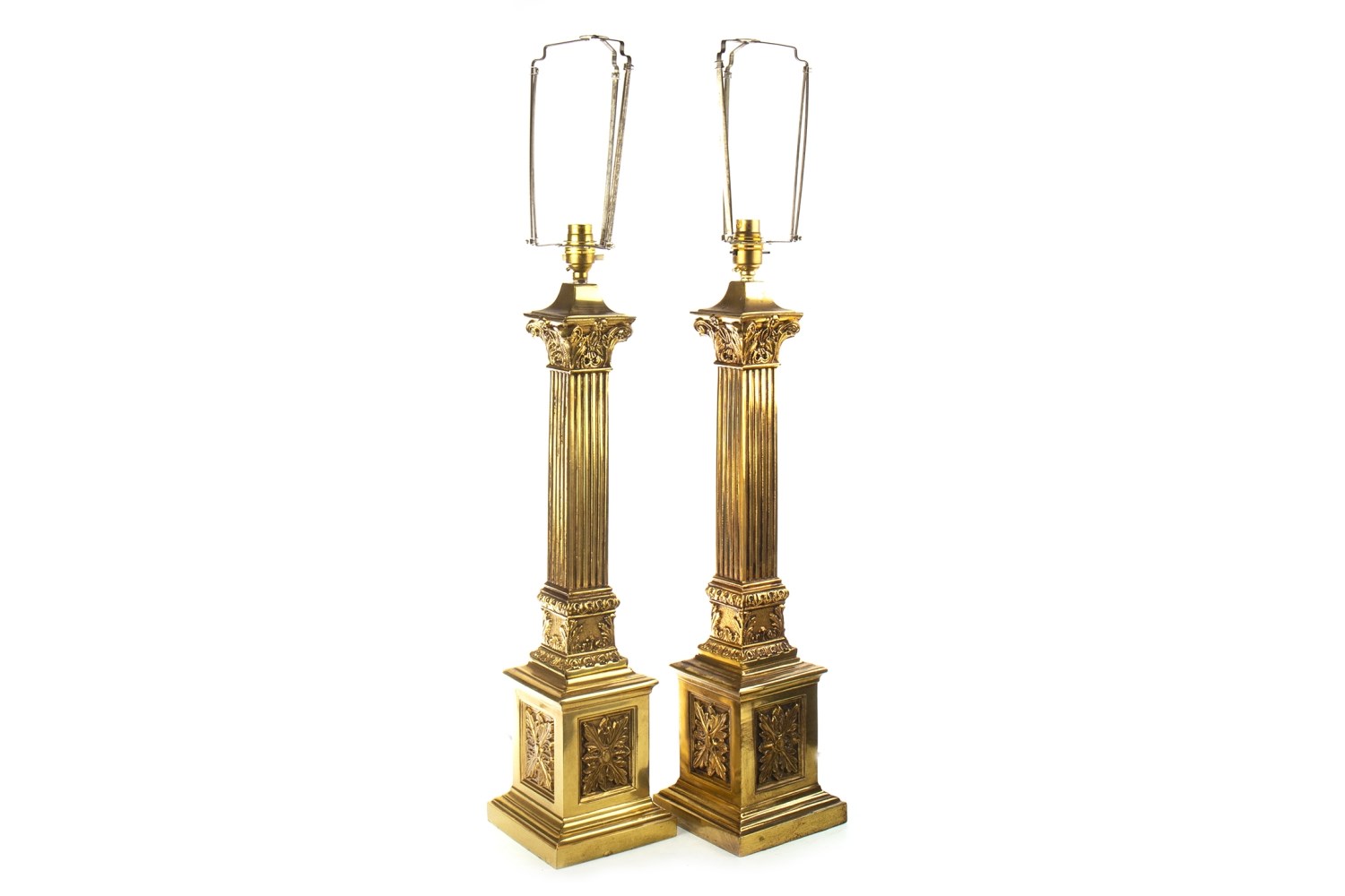 A PAIR OF BRASS CORINTHIAN PILLAR TABLE LAMPS AND ANOTHER