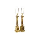 A PAIR OF BRASS CORINTHIAN PILLAR TABLE LAMPS AND ANOTHER