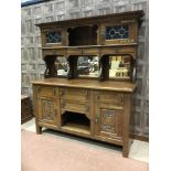 AN OAK SIDEBOARD OF ARTS & CRAFTS DESIGN