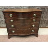 A MAHOGANY SERPENTINE COMMODE CHEST