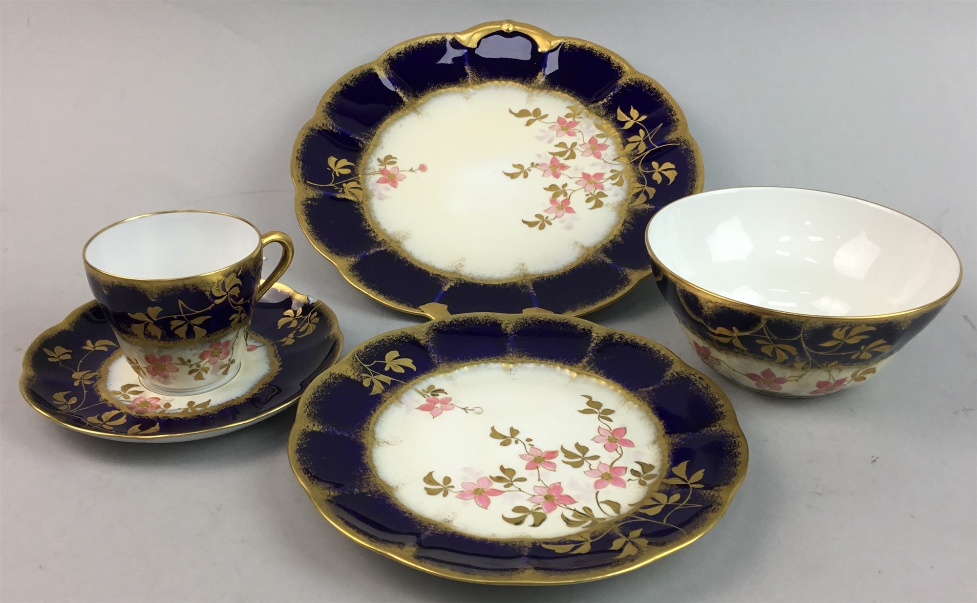 A LOT OF LIMOGES FLORAL AND GILT DECORATED TEA WARE