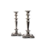 A PAIR OF SILVER PLATED CANDLESTICKS OF EDWARDIAN DESIGN