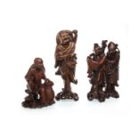 A GROUP OF THREE CARVED WOOD FIGURES