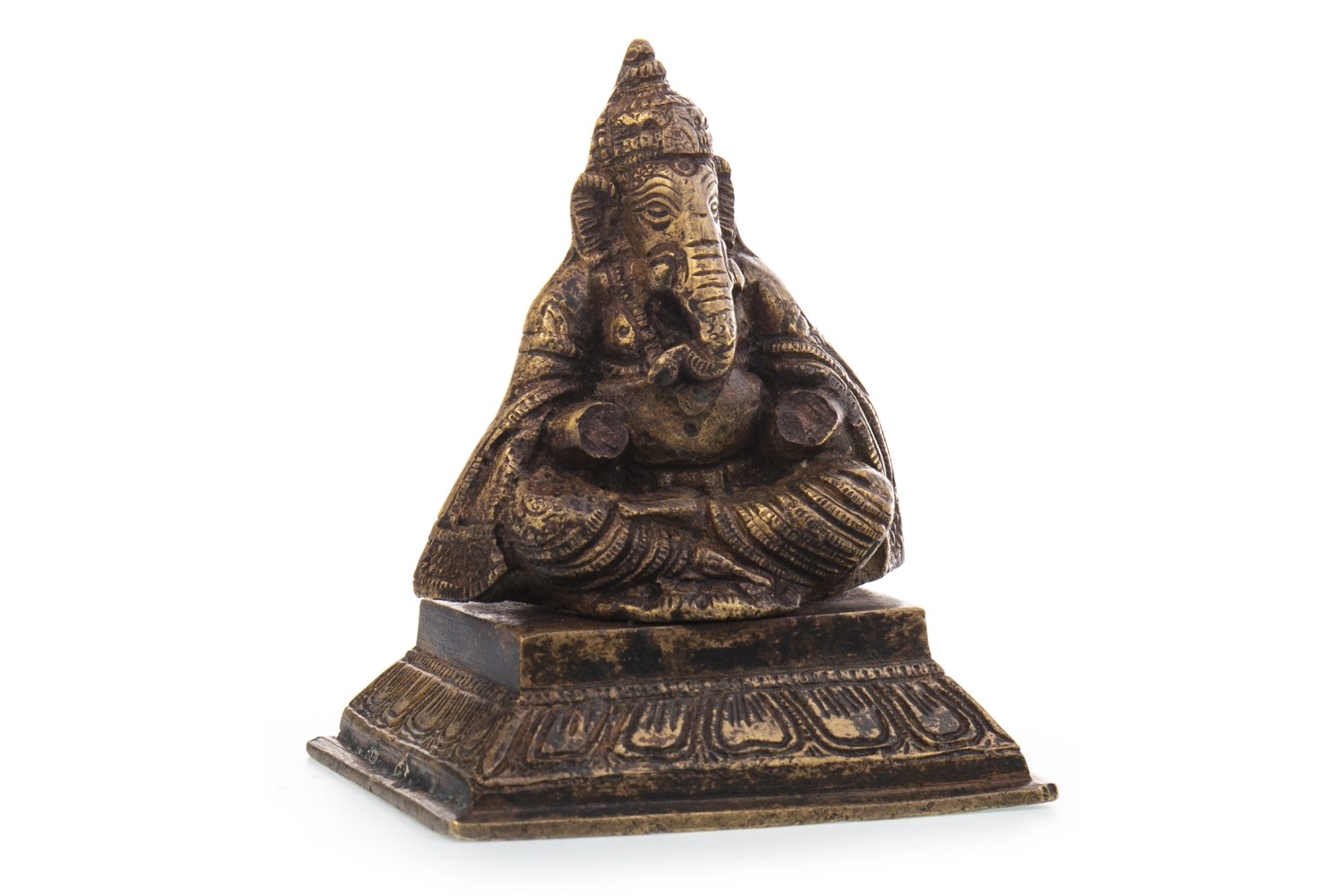 AN INDIAN GILDED METAL FIGURE OF GANESH