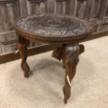 AN EARLY 20TH CENTURY INDIAN CARVED WOOD TABLE AND STANDARD LAMP