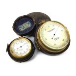 A 19TH CENTURY TRAVELLING SURVEYING ANEROID BAROMETER AND A POCKET BAROMETER