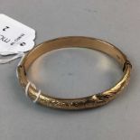 A NINE CARAT GOLD BANGLE