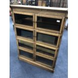 AN OAK FOUR SECTION STACKING BOOKCASE