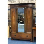 AN EDWARDIAN MAHOGANY INLAID SINGLE DOOR WARDROBE