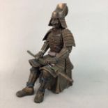 A RESIN FIGURE OF A SEATED SAMURAI