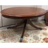 A MAHOGANY OVAL COFFEE TABLE