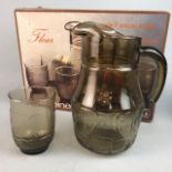 A LUMINARC SMOKY GLASS JUG AND SIX GOBLETS AND ANOTHER BOXED SET OF SUNDAE DISHES