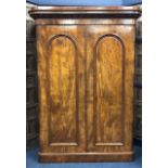 A VICTORIAN MAHOGANY TWO DOOR WARDROBE