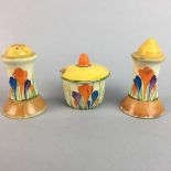 A CLARICE CLIFF SALT AND PEPPER AND A MUSTARD POT