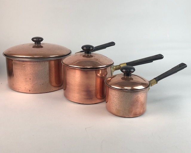 A SET OF THREE GRADUATED COPPER POTS AND ANOTHER