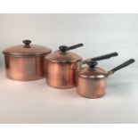 A SET OF THREE GRADUATED COPPER POTS AND ANOTHER