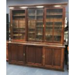 A VICTORIAN STAINED WOOD BOOKCASE ON DRESSER