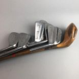 A GROUP OF VINTAGE SIMULATED CANE SHAFTED GOLF CLUBS
