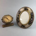 A HARDSTONE OVAL FRAME AND A CLOCK