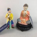 A SMALL POLYCHROME POTTERY BUDDHA AND ANOTHER CERAMIC FIGURE