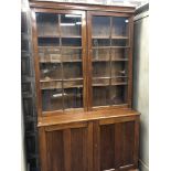 AN EARLY 20TH CENTURY MAHOGANY CABINET BOOKCASE