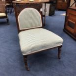 A LATE VICTORIAN STAINED OAK NURSING CHAIR