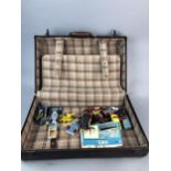 A VINTAGE SUITCASE WITH TOY CARS