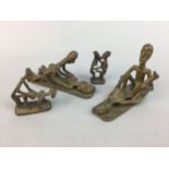 FOUR AFRICAN BRASS EROTIC FIGURES