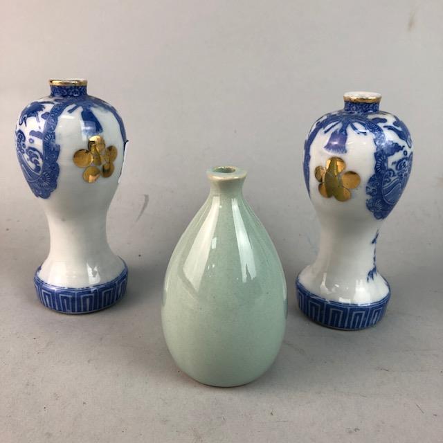 A SMALL PAIR OF CHINESE BLUE AND WHITE BALUSTER VASES AND A CELADON VASE