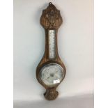 AN ANEROID BAROMETER AND THERMOMETER