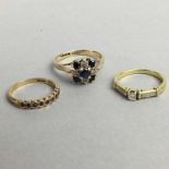 A 15 CARAT GOLD ENGAGEMENT RING and TWO OTHER GOLD RINGS
