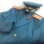 A RUSSIAN GREEN SERGE UNIFORM AND CAP