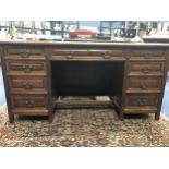 A MAHOGANY KNEE HOLE WRITING DESK