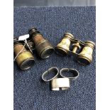 A SET OF FIELD GLASSES, NAPKIN RINGS AND A SET OF OPERA GLASSES