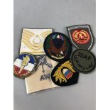 A COLLECTION OF BADGES AND COSTUME JEWELLERY