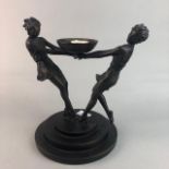 AN ART DECO STYLE FIGURAL CANDLE HOLDER