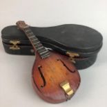 A MINIATURE MANDOLIN IN CARRY CASE