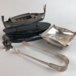 A CONTINENTAL SILVER MODEL OF A BOAT, SILVER TONGS AND ANOTHER DISH