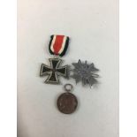 A GERMAN IRON CROSS, A FINNISH MEDAL AND ANOTHER