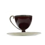 A NORWEGIAN SILVER AND CRIMSON GUILLOCHE ENAMEL CUP AND SAUCER BY MARIUS HAMMER