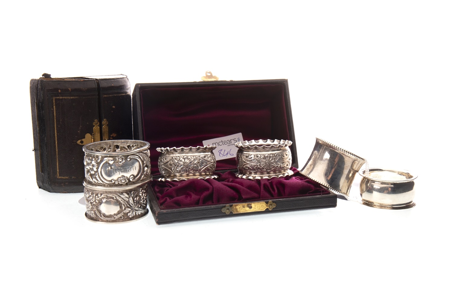 A LATE VICTORIAN SILVER NAPKIN RING AND FIVE OTHERS
