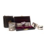 A LATE VICTORIAN SILVER NAPKIN RING AND FIVE OTHERS