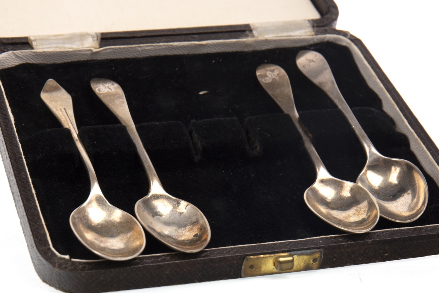 A SET OF FOUR SILVER SAUCE LADLES ALONG WITH SILVER SPOONS