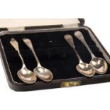 A SET OF FOUR SILVER SAUCE LADLES ALONG WITH SILVER SPOONS