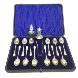 A CASED SET OF SILVER TEASPOONS AND TONGS ALONG WITH TWO SHAKERS