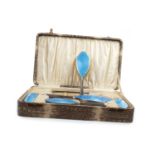 A CASED GEORGE V SILVER AND BLUE GUILLOCHE ENAMEL VANITY SET