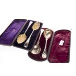 A PAIR OF GEORGE III SILVER AND PARCEL GILT SERVING SPOONS AND ANOTHER PAIR OF SPOONS